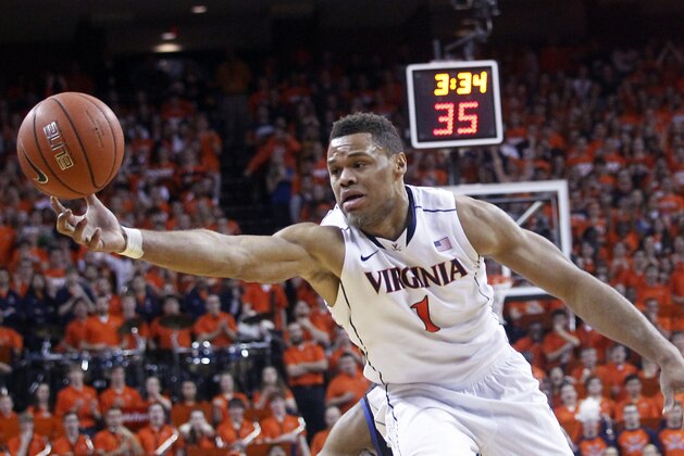 Virginia guard Justin Anderson goes after a rebound during the first half of an NCAA college basketball game against Duke in Charlottesville, Va., on Saturday, Jan. 31, 2015. (AP Photo/Ryan M. Kelly)