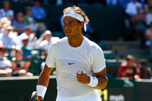 LONDON, ENGLAND - JUNE 30:  Rafael Nadal of Spain reacts in his Gentlemens Singles first round match against Thomaz Bellucci of Brazil during day two of the Wimbledon Lawn Tennis Championships at the All England Lawn Tennis and Croquet Club on June 30, 2015 in London, England.  (Photo by Julian Finney/Getty Images)