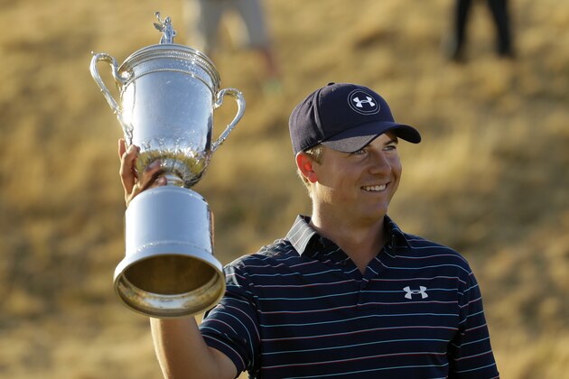 Jordan Spieth holds up the trophy after winning the U.S. Open golf tournament at Chambers Bay on Sunday, June 21, 2015 in University Place, Wash. (AP Photo/Ted S. Warren)