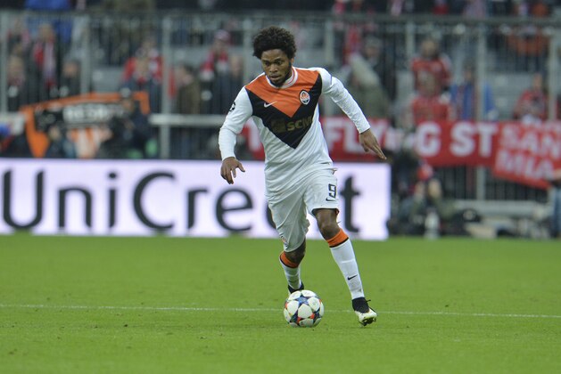 Shakhtar's Luiz Adriano goes with the ball during the Champions League round of 16 second leg soccer match between Bayern Munich and Shakhtar Donetsk Wednesday, March 11, 2015 in Munich, southern Germany. (AP Photo/Kerstin Joensson)