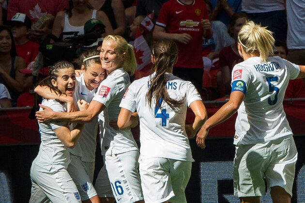 VANCOUVER, BC - JUNE 27: Jodie Taylor #19 of England is congratulates by team mates Katie Chapman #16, Fara Williams #4, Steph Houghton #5 and Karen Carney #10 after scoring against Canada during the FIFA Women's World Cup Canada 2015 Quarter Final match between the England and Canada June, 27, 2015 at BC Place Stadium in Vancouver, British Columbia, Canada.  (Photo by Rich Lam/Getty Images)