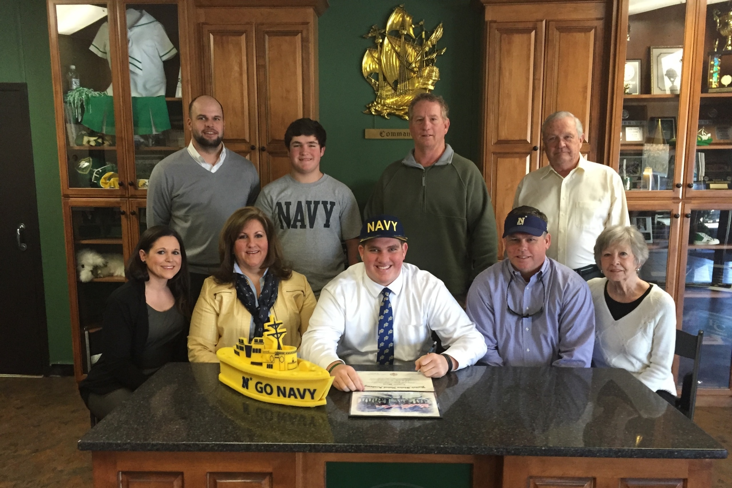 Wood, center, signed with the Naval Academy in February. Wood, center, signed with the Naval Academy in February.