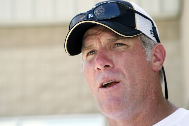FILE - In this July 30, 2012, file photo, former NFL quarterback Brett Favre speaks to the media in Hattiesburg, Miss. Favre says he couldn't be happier to see Peyton Manning on the brink of breaking his NFL record of 508 touchdown throws. Manning has 503 heading into Denver's road game Sunday, Oct. 12, 2014, against the New York Jets.  (AP Photo/Rogelio V. Solis, File)