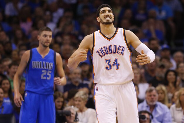 Oklahoma City Thunder center Enes Kanter (34) reacts after being fouled in the first quarter of an NBA basketball game against the Dallas Mavericks in Oklahoma City, Wednesday, April 1, 2015. (AP Photo/Sue Ogrocki)