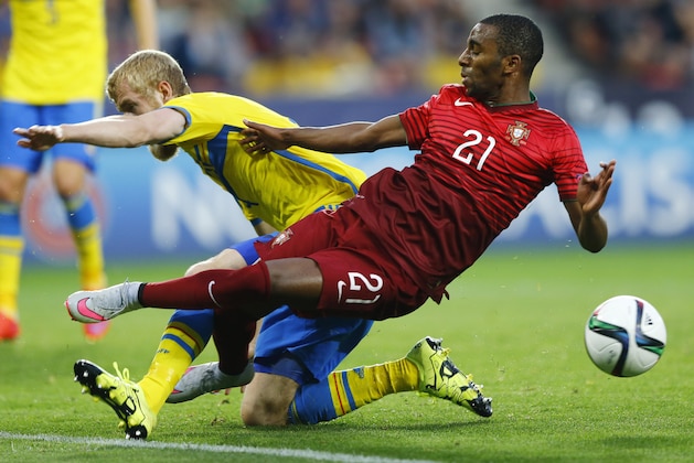 Sweden’s Filip Helander, left, and Portugal’s Ricardo challenge for the ball during the final match at the Euro U21 soccer championship between Sweden and Portugal at the Eden stadium in Prague, Czech Republic, Tuesday, June 30, 2015. (AP Photo/Matthias Schrader)