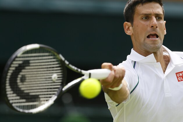 Novak Djokovic of Serbia plays a return to Philipp Kohlschreiber of Germany during the men's singles first round match at the All England Lawn Tennis Championships in Wimbledon, London, Monday June 29, 2015. (AP Photo/Kirsty Wigglesworth)