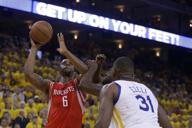 Houston Rockets forward Terrence Jones (6) shoots against Golden State Warriors center Festus Ezeli (31) and forward Draymond Green during the first half of Game 5 of the NBA basketball Western Conference finals in Oakland, Calif., Wednesday, May 27, 2015. (AP Photo/Ben Margot)
