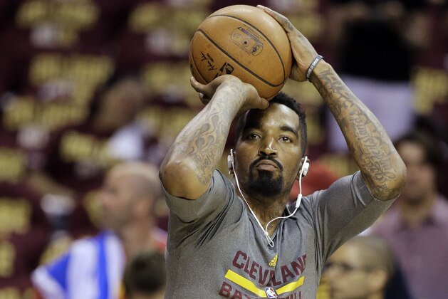 Cleveland Cavaliers guard J.R. Smith shoots during warm ups before Game 4 of basketball's NBA Finals between the Cleveland Cavaliers and the Golden State Warriors, in Cleveland, Thursday, June 11, 2015. (AP Photo/Tony Dejak)