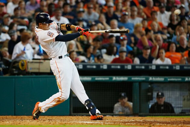 HOUSTON, TX - JUNE 27:  Carlos Correa #1 of the Houston Astros slugs a double in the seventh inning during their game against the New York Yankees at Minute Maid Park on June 27, 2015 in Houston, Texas.  (Photo by Scott Halleran/Getty Images)