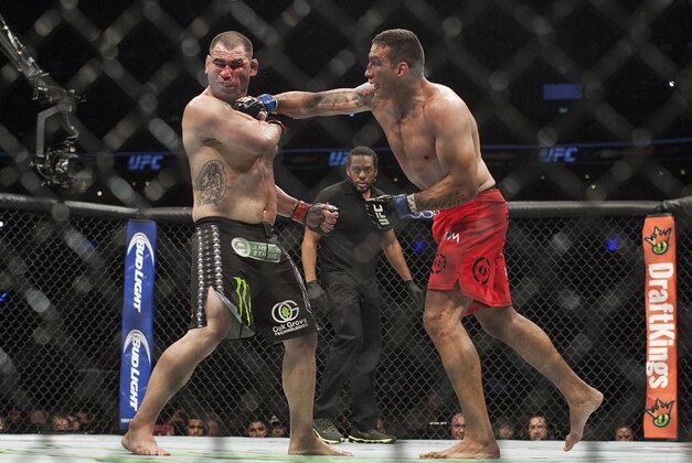 Brazil's Fabricio Werdum lands a punch to United States' Cain Velasquez during a heavyweight mixed martial arts title bout at UFC 188 in Mexico City, Saturday, June 13, 2015. Werdum won the fight by submission. (AP Photo/Christian Palma)