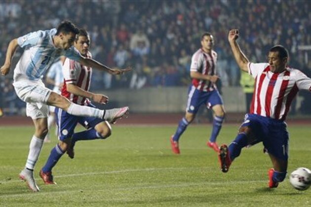 Argentina's Javier Pastore scores his team's second goal against Paraguay during a Copa America semifinal soccer match at the Ester Roa Rebolledo Stadium in Concepcion, Chile, Tuesday, June 30, 2015. (AP Photo/Silvia Izquierdo)