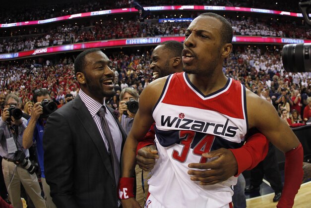 May 9, 2015; Washington, DC, USA; Washington Wizards forward Paul Pierce (34) celebrates with injured Wizards guard John Wall (L) and Washington Wizards forward Martell Webster (M) after making the game-winning basket against the Atlanta Hawks as time expired in the fourth quarter in game three of the second round of the NBA Playoffs. at Verizon Center. The Wizards won 103-101. Mandatory Credit: Geoff Burke-USA TODAY Sports