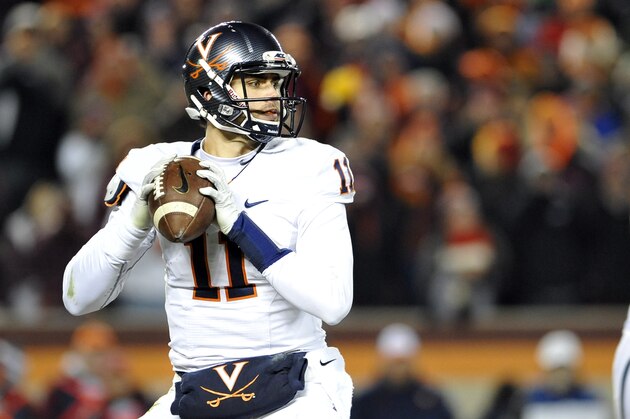 BLACKSBURG, VA - NOVEMBER 28: Quarterback Greyson Lambert #11 of the Virginia Cavaliers looks to throw in the second half against the Virginia Tech Hokies at Lane Stadium on November 28, 2014 in Blacksburg, Virginia. Virginia Tech defeated Virginia 24-20. (Photo by Michael Shroyer/Getty Images)