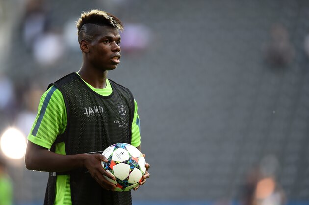 BERLIN, GERMANY - JUNE 05:  Paul Pogba of Juventus looks on during a Juventus training session on the eve of the UEFA Champions League Final match against FC Barcelona at Olympiastadion on June 5, 2015 in Berlin, Germany.  (Photo by Laurence Griffiths/Getty Images)