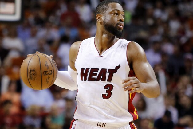 Miami Heat guard Dwyane Wade takes the ball downcourt in the first half against the Detroit Pistons in an NBA basketball game, Sunday, March 29, 2015, in Miami. Miami won 109-102 with Wade scoring 40 points.  (AP Photo/Joe Skipper)