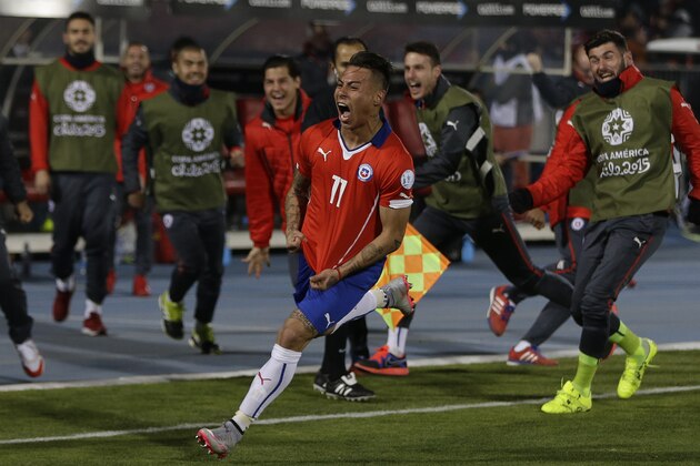 Chile's Eduardo Vargas  celebrates after scoring his team's second goal during a Copa America semifinal soccer match at the National Stadium in Santiago, Chile, Monday, June 29, 2015. (AP Photo/Ricardo Mazalan)