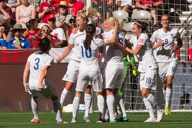 VANCOUVER, BC - JUNE 27: Fara Williams #4 of England celebrates team mate Lucy Bronze's #12 (not pictured) goal against Canada with teammates during the FIFA Women's World Cup Canada 2015 Quarter Final match between the England and Canada June, 27, 2015 at BC Place Stadium in Vancouver, British Columbia, Canada.  (Photo by Rich Lam/Getty Images)