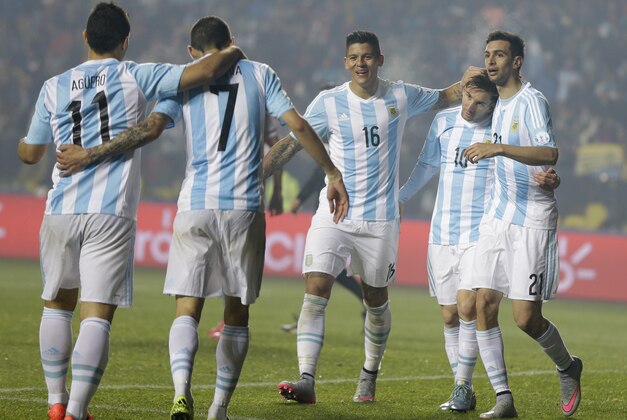 Argentina's players, from left, Javier Pastore, Lionel Messi, Marcos Rojo, Angel Di Maria and Sergio Aguero celebrate the goal by Di Maria, 7, during a Copa America semifinal soccer match at the Ester Roa Rebolledo Stadium in Concepcion, Chile, Tuesday, June 30, 2015. (AP Photo/Ricardo Mazalan)