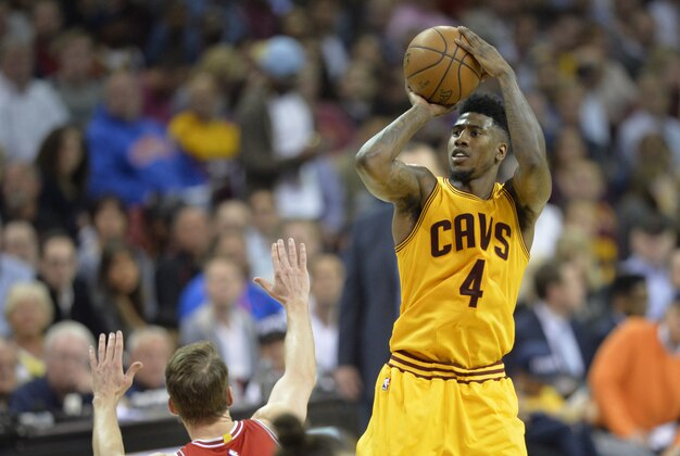 May 12, 2015; Cleveland, OH, USA; Cleveland Cavaliers guard Iman Shumpert (4) shoots in the second quarter against the Chicago Bulls in game five of the second round of the NBA Playoffs at Quicken Loans Arena. Mandatory Credit: David Richard-USA TODAY Sports