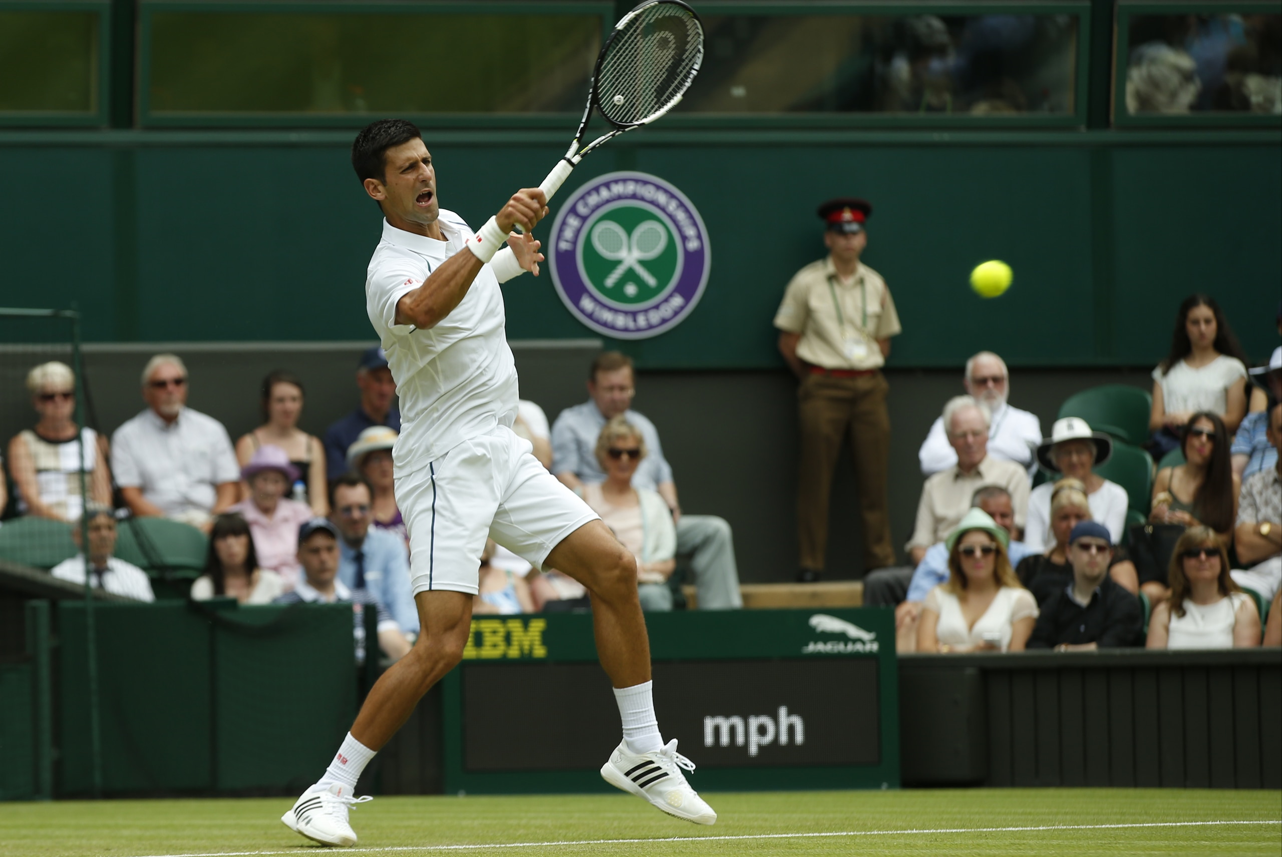Novak Djokovic of Serbia returns a ball to Jarkko Nieminen of Finland, during their singles match at the All England Lawn Tennis Championships in Wimbledon, London, Wednesday July 1, 2015. (AP Photo/Alastair Grant) Novak Djokovic of Serbia returns a ball to Jarkko Nieminen of Finland, during their singles match at the All England Lawn Tennis Championships in Wimbledon, London, Wednesday July 1, 2015. (AP Photo/Alastair Grant)