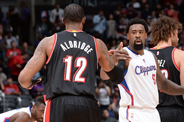 LOS ANGELES, CA - MARCH 4:  LaMarcus Aldridge #12 of the Portland Trail Blazers greets DeAndre Jordan #6 of the Los Angeles Clippers before the game on March 4, 2015 at Staples Center in Los Angeles, California. NOTE TO USER: User expressly acknowledges and agrees that, by downloading and or using this Photograph, user is consenting to the terms and conditions of the Getty Images License Agreement. Mandatory Copyright Notice: Copyright 2015 NBAE (Photo by Andrew D. Bernstein/NBAE via Getty Images)