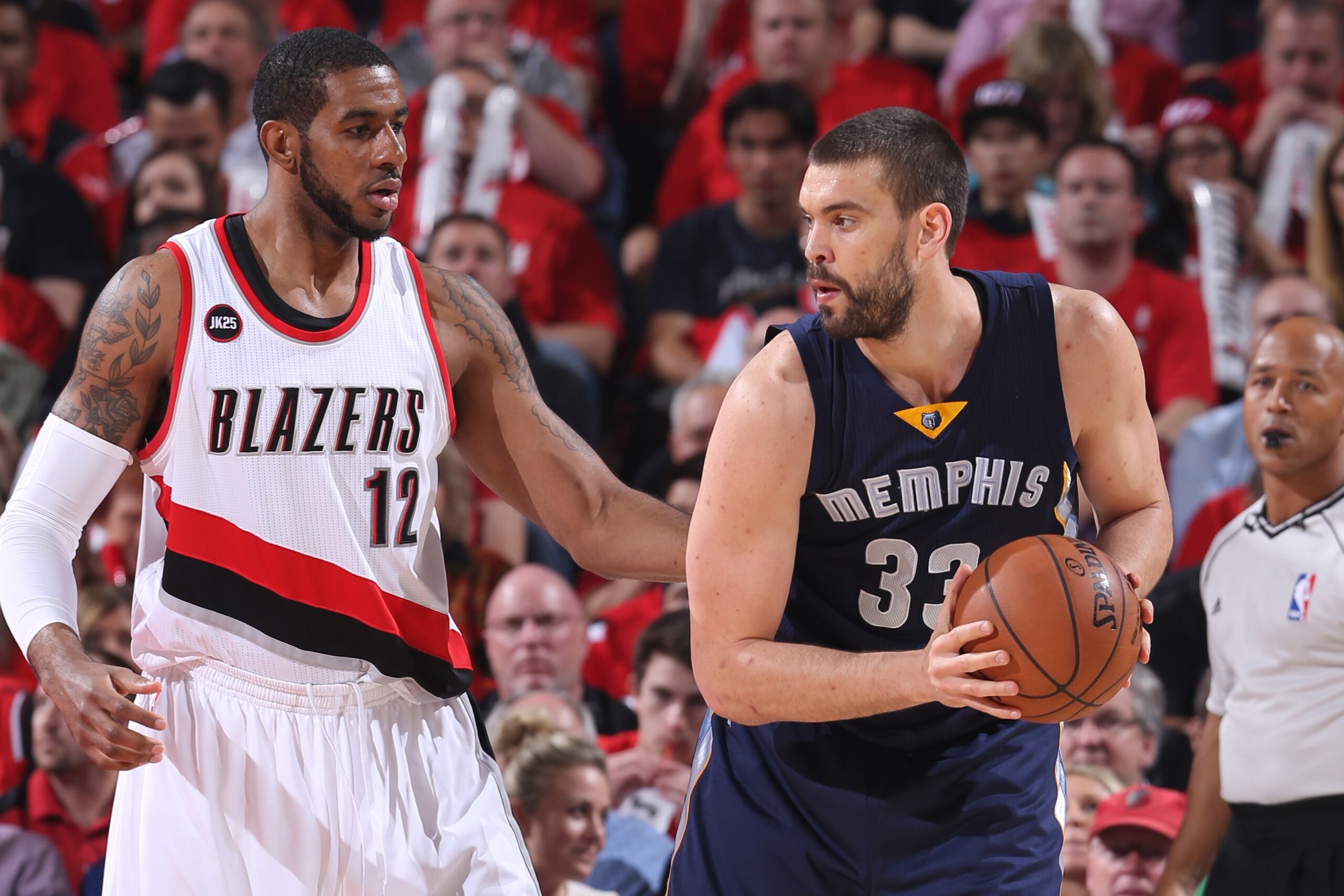 PORTLAND, OR - APRIL 27:  Marc Gasol #33 of the Memphis Grizzlies looks to drive to the basket against LaMarcus Aldridge #12 of the Portland Trail Blazers in Game Four of the Western Conference Quarterfinals during the 2015 NBA Playoffs on April 27, 2015 at the Moda Center in Portland, Oregon. NOTE TO USER: User expressly acknowledges and agrees that, by downloading and or using this photograph, User is consenting to the terms and conditions of the Getty Images License Agreement. Mandatory Copyright Notice: Copyright 2015 NBAE (Photo by Sam Forencich/NBAE via Getty Images)