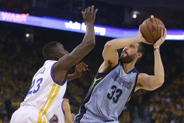 Memphis Grizzlies center Marc Gasol (33) shoots against Golden State Warriors forward Draymond Green during the first half of Game 5 in a second-round NBA playoff basketball series in Oakland, Calif., Wednesday, May 13, 2015. (AP Photo/Ben Margot)