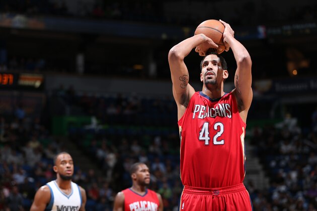 MINNEAPOLIS, MN - APRIL 13: Alexis Ajinca #42 of the New Orleans Pelicans shoots against the Minnesota Timberwolves during the game on April 13, 2015 at Target Center in Minneapolis, Minnesota. NOTE TO USER: User expressly acknowledges and agrees that, by downloading and/or using this photograph, User is consenting to the terms and conditions of the Getty Images License Agreement. Mandatory Copyright Notice: Copyright 2015 NBAE (Photo by David Sherman/NBAE via Getty Images)