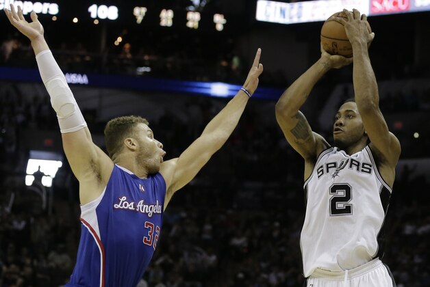 San Antonio Spurs forward Kawhi Leonard (2) shoots against Los Angeles Clippers forward Blake Griffin during the second half of Game 4 in an NBA basketball first-round playoff series, Sunday, April 26, 2015, in San Antonio. Los Angeles won 114-105. (AP Photo/Darren Abate)