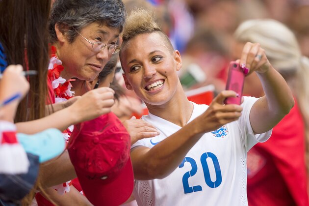 VANCOUVER, BC - JUNE 27: Lianne Sanderson #20 of England takes a picture with fans after the FIFA Women's World Cup Canada 2015 Quarter Final match between the England and Canada June, 27, 2015 at BC Place Stadium in Vancouver, British Columbia, Canada.  (Photo by Rich Lam/Getty Images)