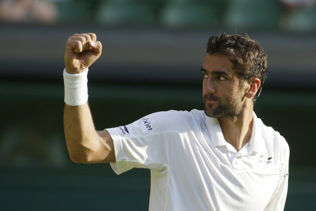 Marin Cilic of Croatia celebrates after defeating Ricardas Berankis of Lithuania during their singles match at the All England Lawn Tennis Championships in Wimbledon, London, Wednesday July 1, 2015. Cilic won 6-3, 4-6, 7-6, 4-6, 7-5. (AP Photo/Alastair Grant)
