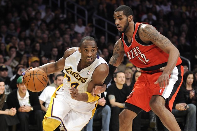 Los Angeles Lakers guard Kobe Bryant (24) gets by Portland Trail Blazers forward LaMarcus Aldridge (12) as he drives to the basket in the second half of an NBA basketball game, Sunday, March 20, 2011, in Los Angeles.  The Lakers won 84-80. (AP Photo/Gus Ruelas)