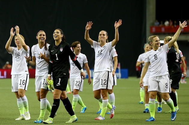 MONTREAL, QC - JUNE 30:  Alex Morgan #13, Hope Solo #1 and Lauren Holiday #12 of the United States celebrate the 2-0 victory against Germany in the FIFA Women's World Cup 2015 Semi-Final Match at Olympic Stadium on June 30, 2015 in Montreal, Canada.  (Photo by Elsa/Getty Images)