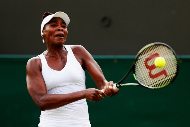 LONDON, ENGLAND - JULY 01:  Venus Williams of the United States plays a backhand in her Ladies Singles Second Round match against Yulia Putintseva of Kazakhstan during day three of the Wimbledon Lawn Tennis Championships at the All England Lawn Tennis and Croquet Club on July 1, 2015 in London, England.  (Photo by Julian Finney/Getty Images)