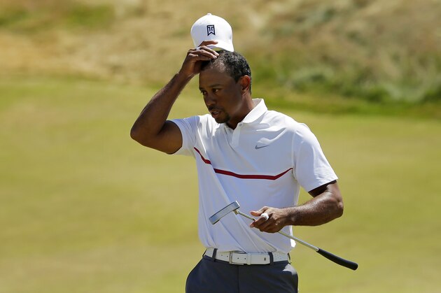Tiger Woods removes his hat after his  second round in the U.S. Open golf tournament at Chambers Bay on Friday, June 19, 2015 in University Place, Wash. (AP Photo/Ted S. Warren)