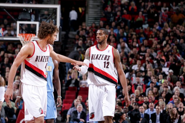 PORTLAND, OR - MARCH 1: Robin Lopez #42 and LaMarcus Aldridge #12 of the Portland Trail Blazers celebrate on the court against the Denver Nuggets on March 1, 2014 at the Moda Center Arena in Portland, Oregon. NOTE TO USER: User expressly acknowledges and agrees that, by downloading and or using this photograph, user is consenting to the terms and conditions of the Getty Images License Agreement. Mandatory Copyright Notice: Copyright 2014 NBAE (Photo by Sam Forencich/NBAE via Getty Images)