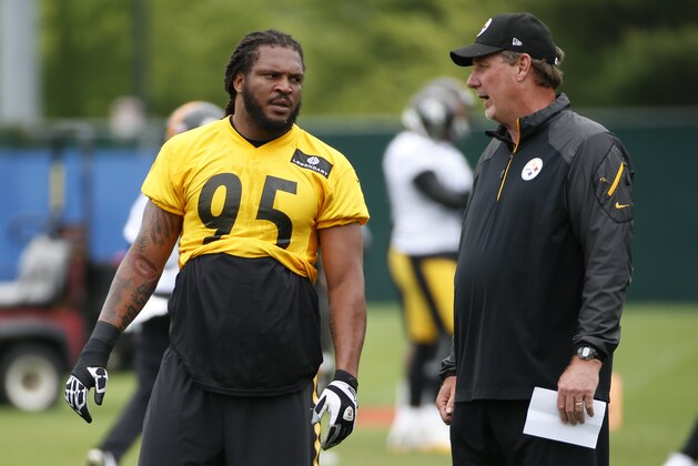 Pittsburgh Steelers linebacker Jarvis Jones (95) talks with defensive coordinator Keith Butler, right, during an NFL football organized team activity, in Pittsburgh, Tuesday, June 2, 2015. (AP Photo/Gene J. Puskar)