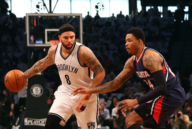 Apr 27, 2015; Brooklyn, NY, USA; Brooklyn Nets guard Deron Williams (8) drives around Atlanta Hawks guard Kent Bazemore (24) during the first quarter in game four of the first round of the NBA Playoffs. at Barclays Center. Mandatory Credit: Anthony Gruppuso-USA TODAY Sports