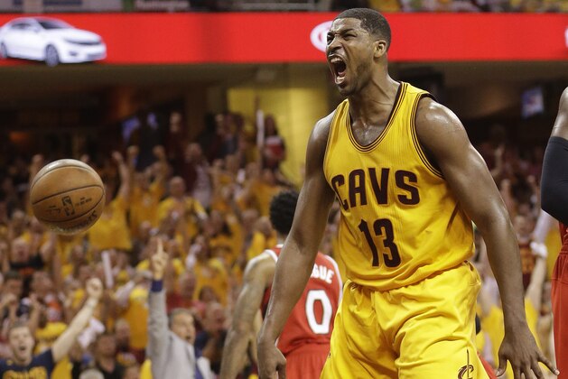 Cleveland Cavaliers center Tristan Thompson (13) reacts after dunking the ball against the Atlanta Hawks in the second half of Game 4 of the NBA basketball Eastern Conference Finals, Tuesday, May 26, 2015, in Cleveland. (AP Photo/Tony Dejak)