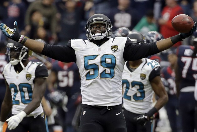Jacksonville Jaguars defensive end Ryan Davis (59) celebrates his interception against the Houston Texans during the fourth quarter of an NFL football game Sunday, Nov. 24, 2013, in Houston. The Jaguars won 13-6. (AP Photo/David J. Phillip) Jacksonville Jaguars defensive end Ryan Davis (59) celebrates his interception against the Houston Texans during the fourth quarter of an NFL football game Sunday, Nov. 24, 2013, in Houston. The Jaguars won 13-6. (AP Photo/David J. Phillip)