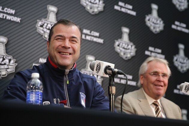 New York Rangers coach Alain Vigneault, left, smiles as he is joined by the team's president and general manager, Glen Sather, during a news conference about Wednesday's Game 1 of NHL Stanley Cup Final hockey series against the Los Angeles Kings, on Tuesday, June 3, 2014, in Los Angeles. (AP Photo/Jae C. Hong)