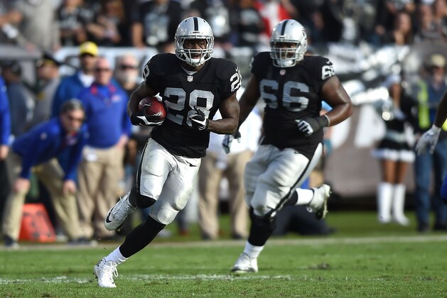 OAKLAND, CA - DECEMBER 21:  Latavius Murray #28 of the Oakland Raiders gains territroy in the second quarter against the Buffalo Bills at O.co Coliseum on December 21, 2014 in Oakland, California.  (Photo by Thearon W. Henderson/Getty Images)