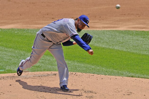 Texas Rangers starting pitcher Yovani Gallardo  delivers during the first inning of a baseball game against the Chicago White Sox on Sunday, June 21, 2015, in Chicago. (AP Photo/Matt Marton)