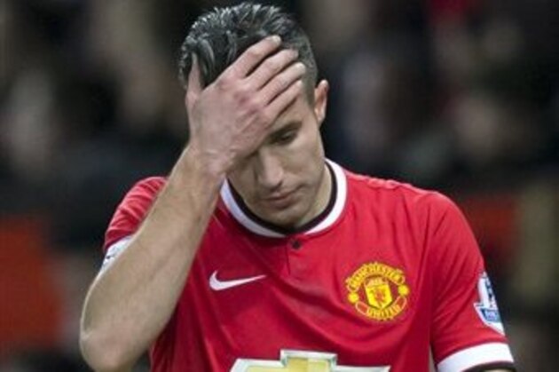 FILE - In this Jan. 11, 2015 file photo, Manchester United's Robin van Persie walks from the pitch after being substituted during his team's English Premier League soccer match between Manchester United and Southampton at Old Trafford Stadium, Manchester, England. (AP Photo/Jon Super, File)