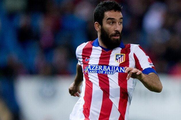 MADRID, SPAIN - DECEMBER 14: Arda Turan of Atletico de Madrid controls the ball during the La Liga match between Club Atletico de Madrid and Villarreal CF at Vicente Calderon Stadium on December 14, 2014 in Madrid, Spain.  (Photo by Gonzalo Arroyo Moreno/Getty Images)