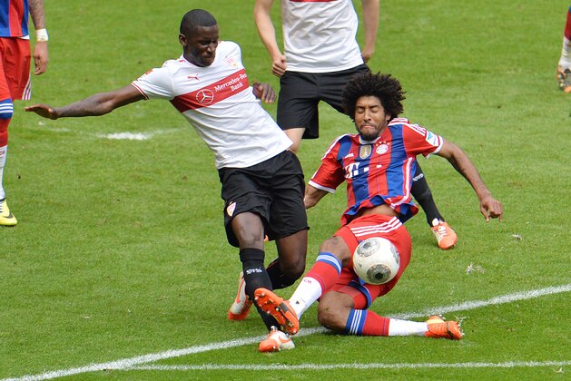 Bayern's Dante of Brazil, right, and Stuttgart's Antonio Ruediger challenge for the ball during the  soccer match between FC Bayern Munich and VfB Stuttgart in the Allianz Arena in Munich, Germany, on Saturday, May 10. 2014. (AP Photo/Kerstin Joensson)