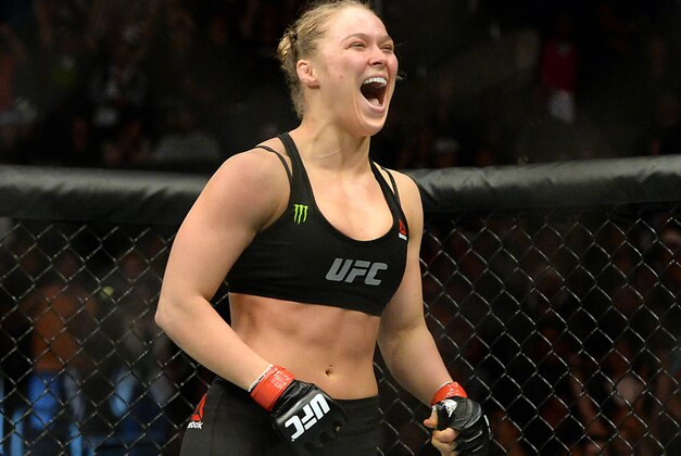 Feb 28, 2015; Los Angeles, CA, USA; Ronda Rousey (red gloves) reacts after defeating Cat Zingano (not pictured) during their women's bantamweight title bout at UFC 184 at Staples Center. Rousey won in 14 seconds of the first round. Mandatory Credit: Jayne Kamin-Oncea-USA TODAY Sports
