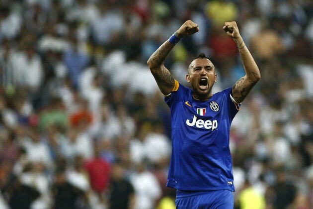 FILE - In this May 13, 2015, file photo, Juventus' Arturo Vidal, from Chile, celebrates after wining the Champions League second leg semifinal soccer match between Real Madrid and Juventus, at the Santiago Bernabeu stadium in Madrid. Vidal will play with the Chile national soccer team in the upcoming 2015 Copa America. (AP Photo/Oscar del Pozo, File)