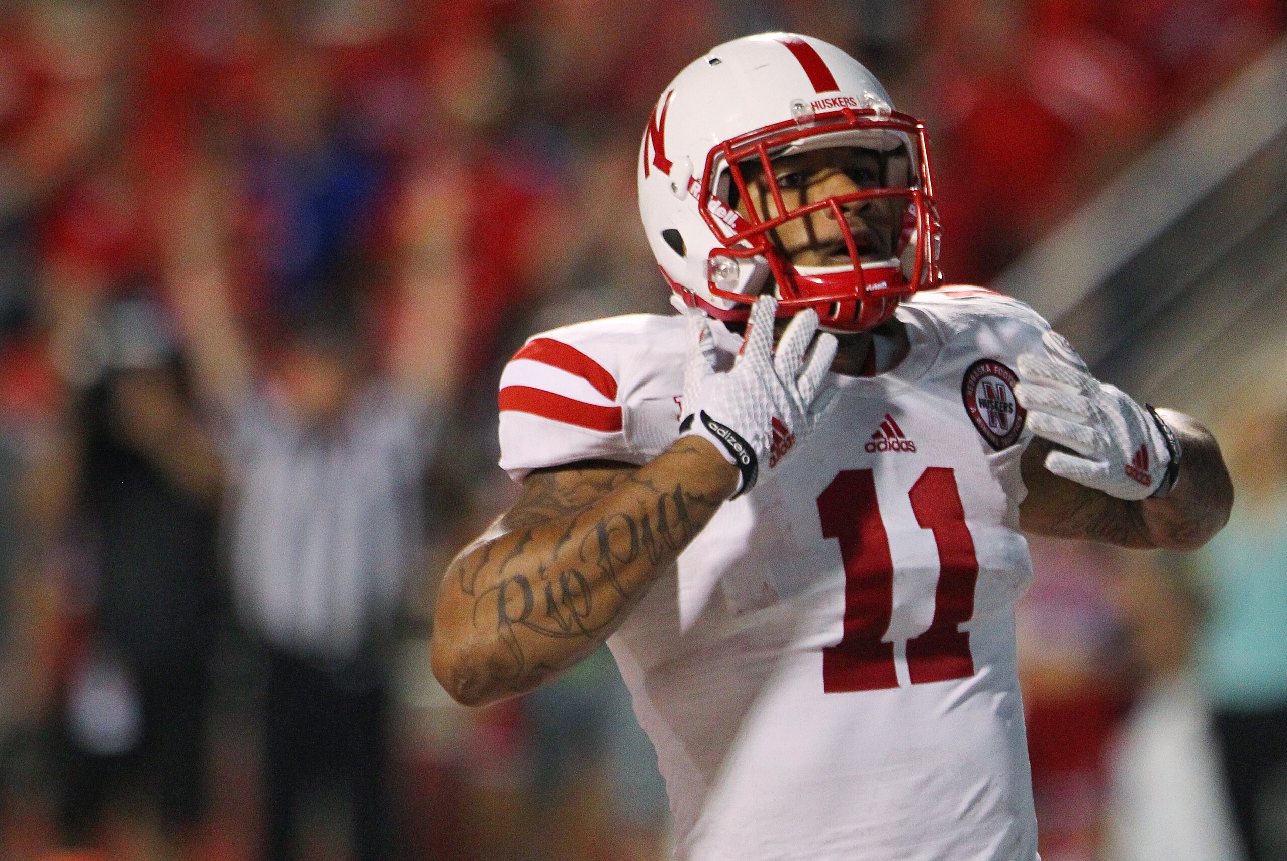 Nebraska's Cethan Carter celebrates a touchdown against Fresno State in the second half of an NCAA college football game in Fresno, Calif., Saturday, Sept. 13, 2014. (AP Photo/Gary Kazanjian)