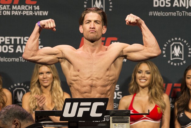 Mar 13, 2015; Dallas, TX, USA;  Sam Stout stands on the scale during weigh-ins for UFC 185 at Kay Bailey Hutchison Convention Center. Mandatory Credit: Tim Heitman-USA TODAY Sports